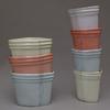 Vases and cups, mixed colors, slip cast porcelain.